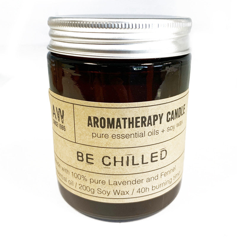 Aromatherapy candle in amber glass jar, crafted with essential oils for relaxation and clarity, presented in a gift box.