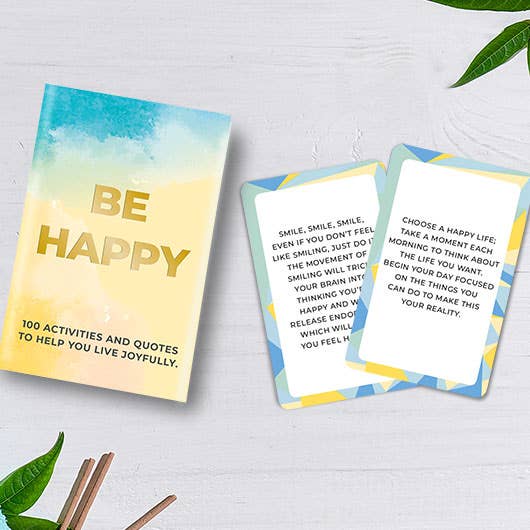 A view from behind of the "Be Happy" self-help cards box, showcasing its colourful design and inviting theme of joy and positivity.