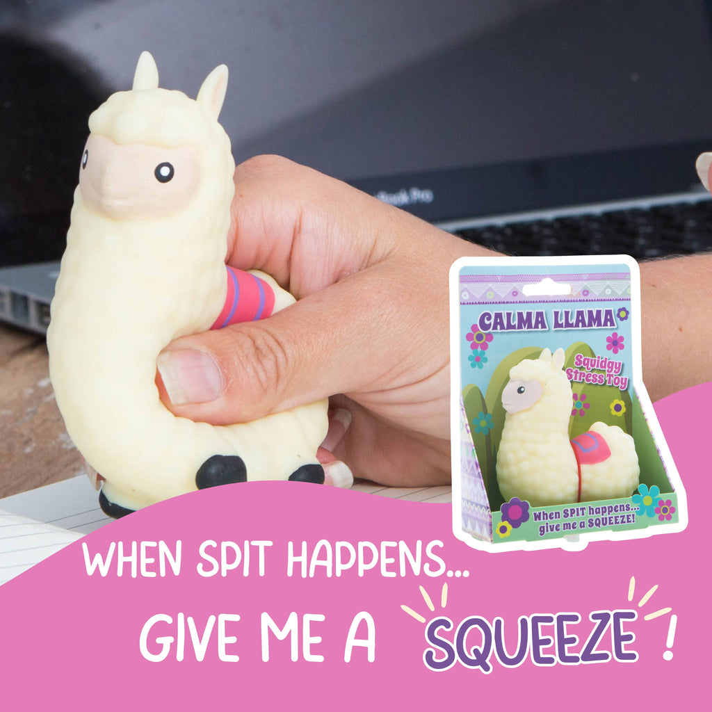 A person grips a soft toy llama that has the words, "When soft happens, give me a squeeze," printed on it.