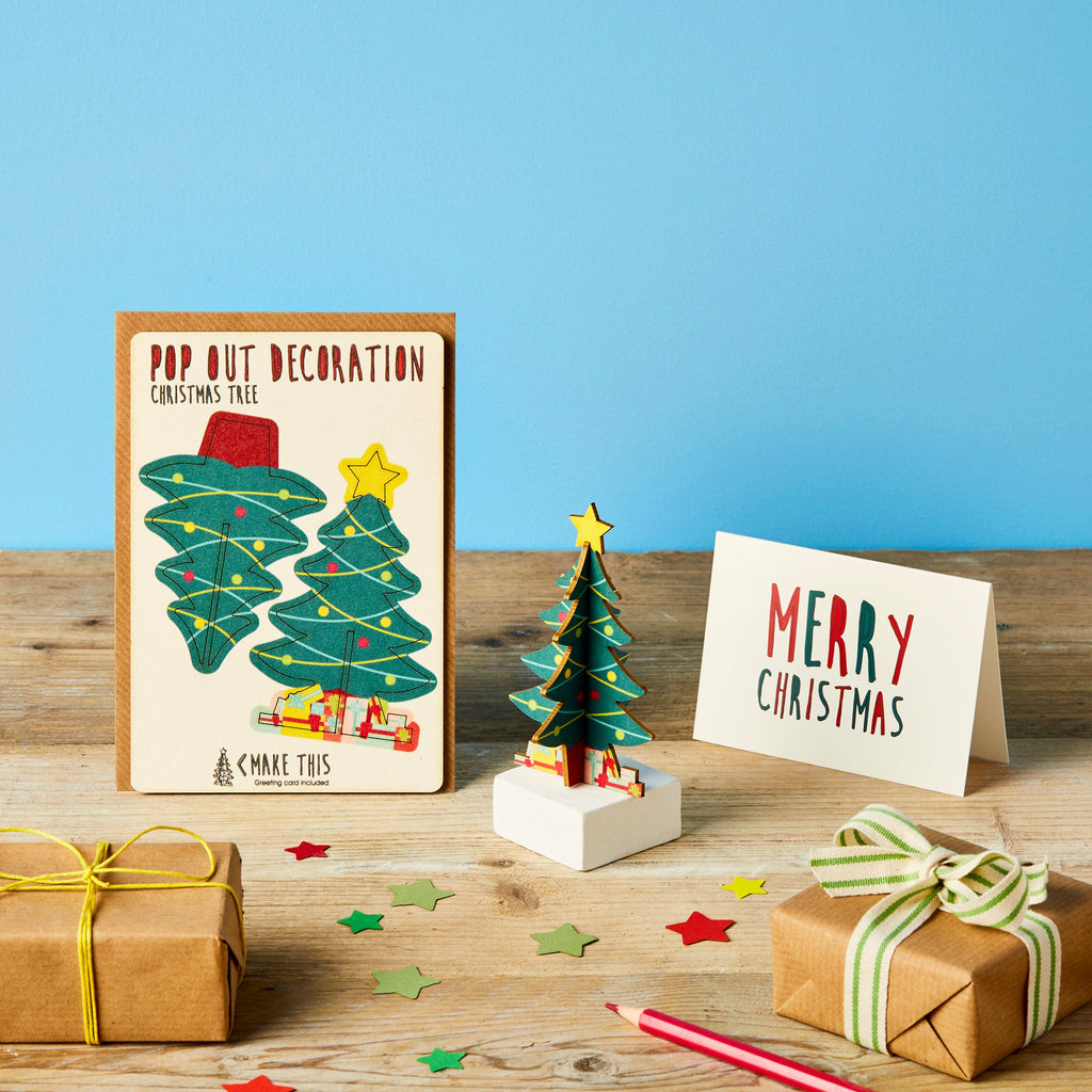 Christmas Tree decoration standing pop out wooden card on a festive blue background