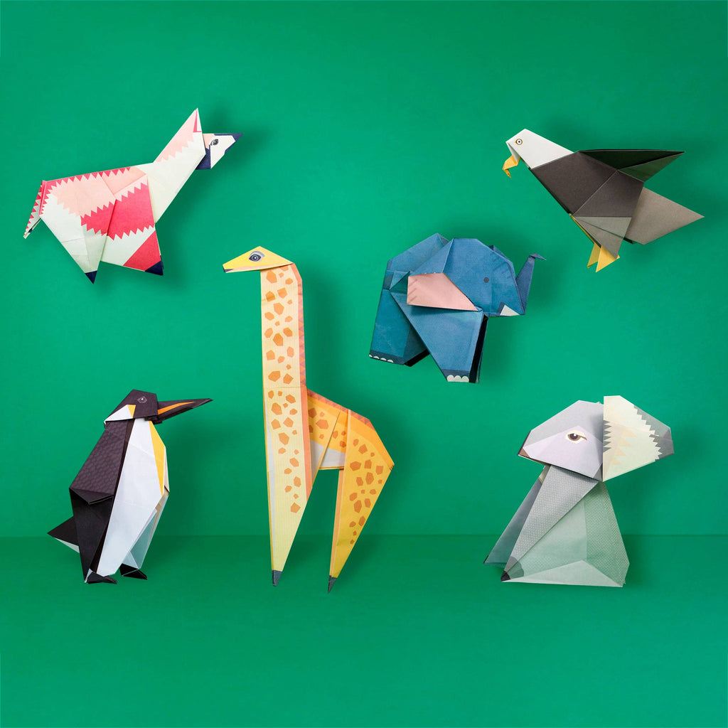 A collection of colourful origami animals displayed against a vibrant green background.