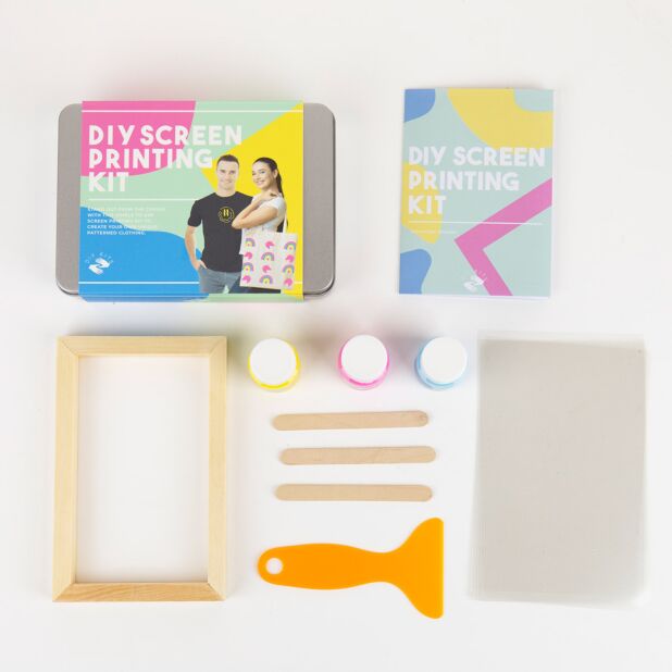 A DIY screen printing kit displayed with various tools and materials for creating custom designs on fabric.