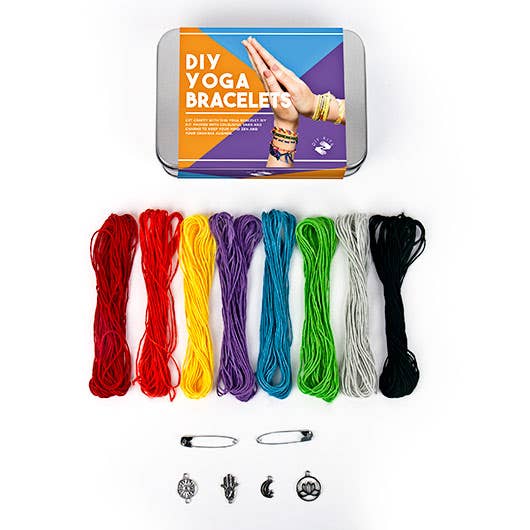 A colourful DIY yoga bracelet kit packaged in a tin, offering various beads for crafting individual yoga-inspired jewellery.