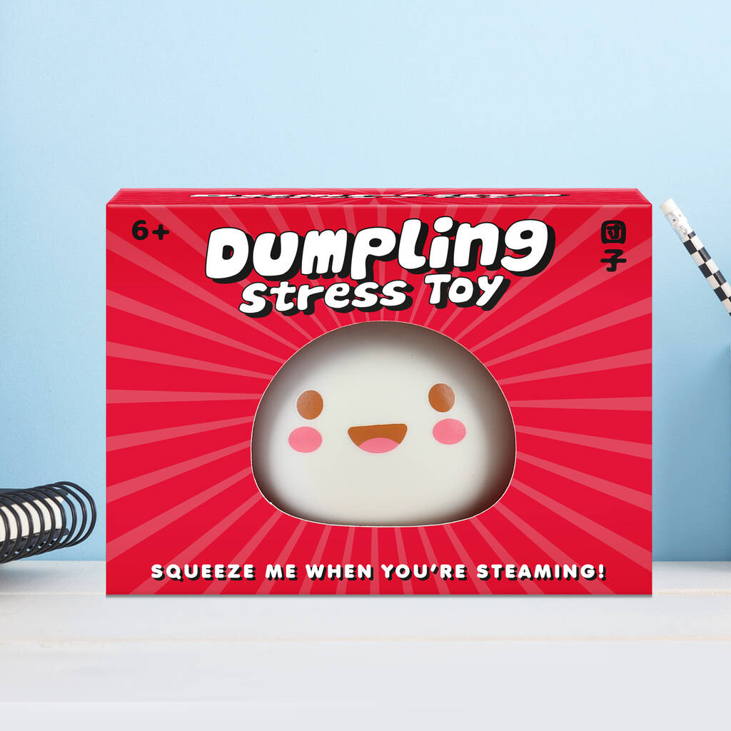 A charming stress toy shaped like a dumpling with a smiley face, housed in a box, ideal for soothing stress and anxiety.