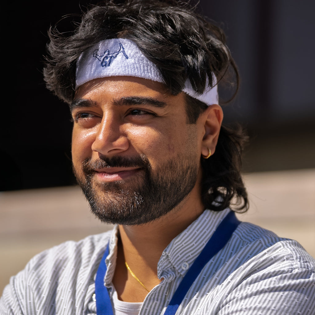 Man wearing a headband with a blurred background