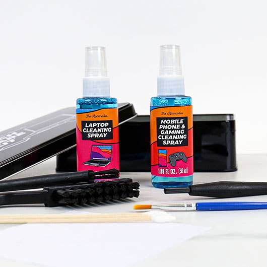 A bottle of cleaner with a brush resting next to it, both on a neutral background.