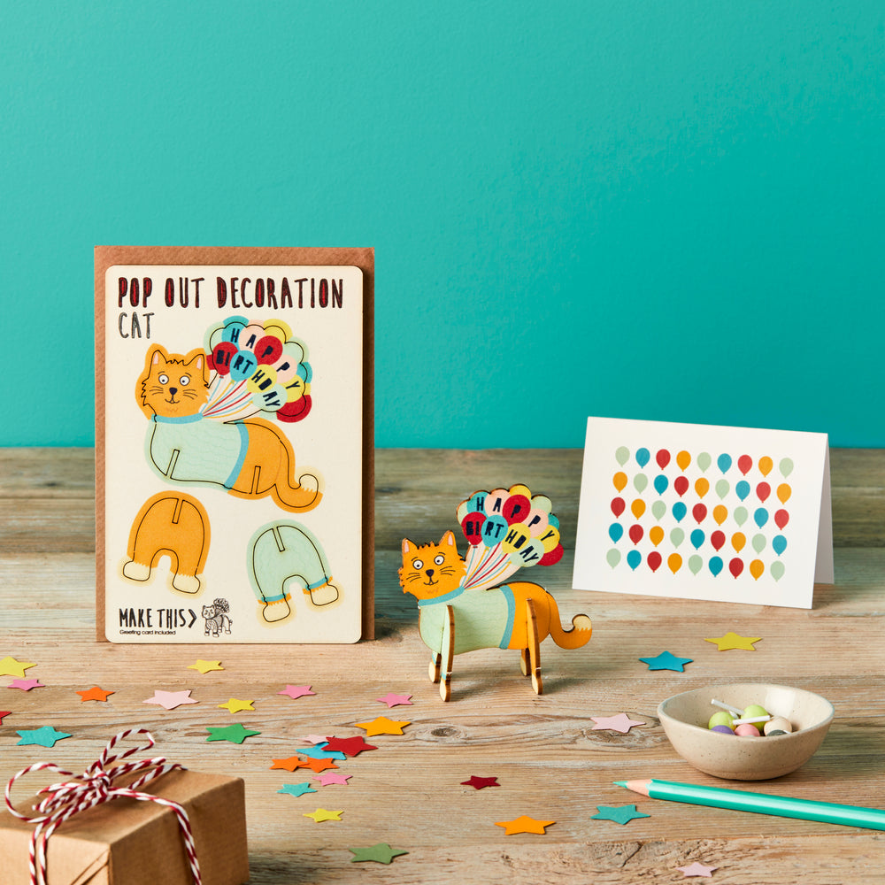 Ginger cat happy birthday pop out wooden card popped out on a birthday background featuring confetti and presents