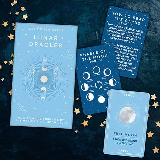 The Lunar Oracles card game displayed with cards and instructions, designed to guide your spiritual journey.
