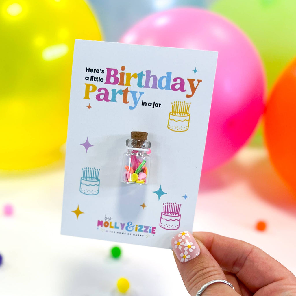 A colourful birthday card with a small party pin affixed, perfect for a birthday celebration.