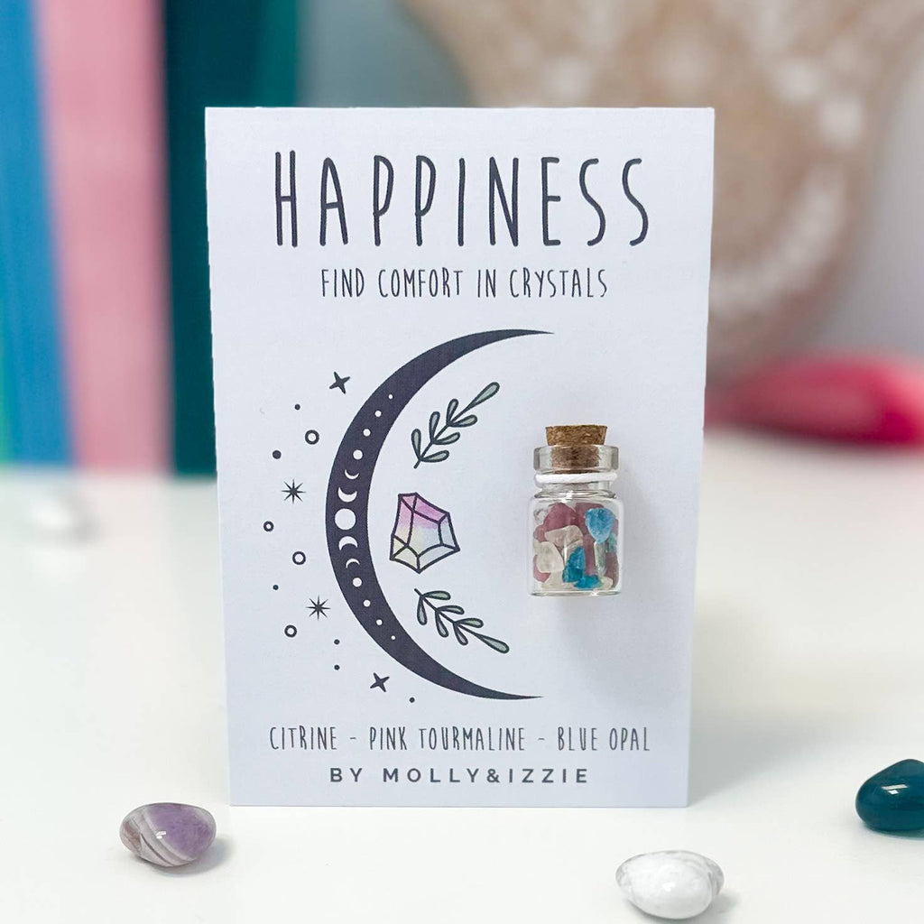 A card featuring a bottle labelled "Happiness" surrounded by colourful crystals, symbolising joy and positivity.