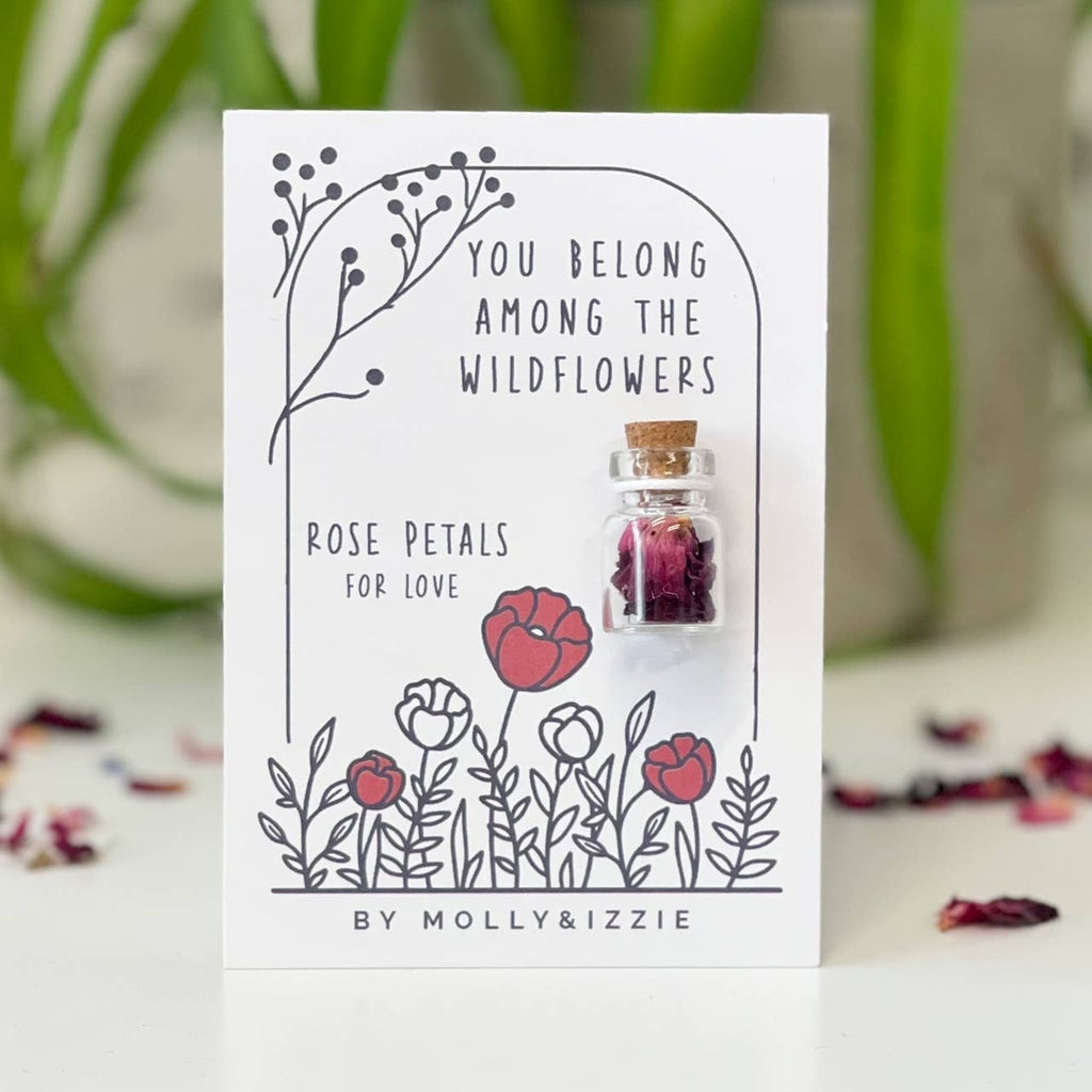 Elegant rose petal mini jar displaying the words "You belong among the wildflowers," adorned with a subtle floral pattern.