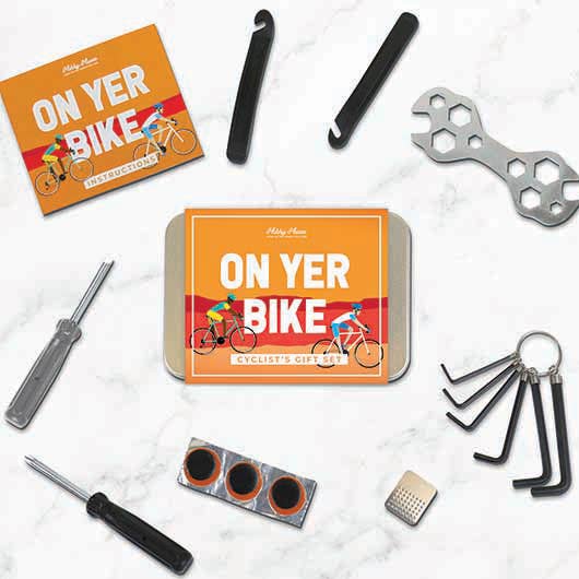 Gift box featuring "On Yer Bike!" cycling-themed items, presented in a decorative tin.