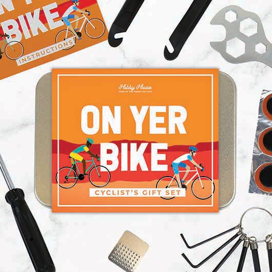 "On Yer Bike!" cycling gift set presented in a stylish tin box, designed for cycling enthusiasts and gift-giving.