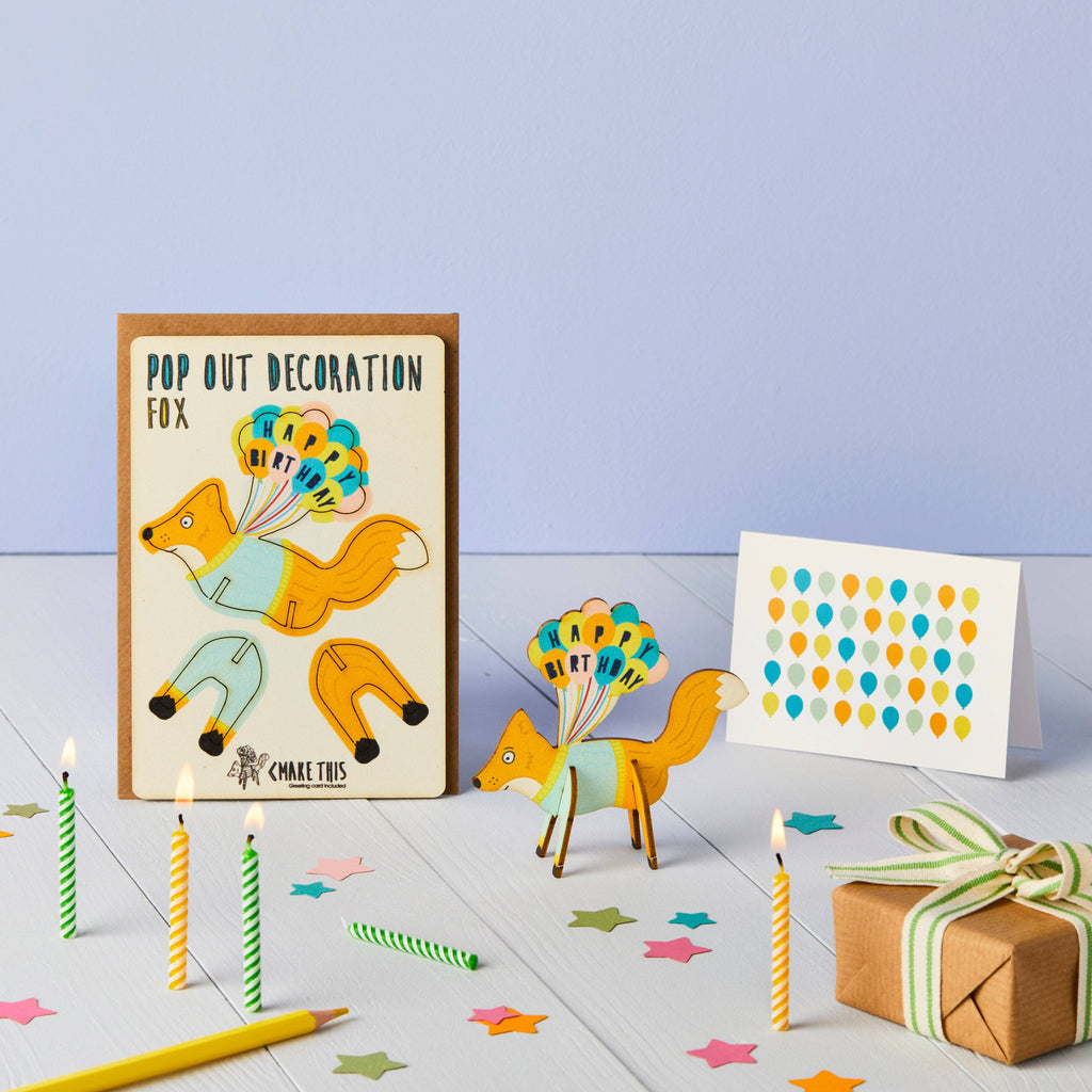 A charming pop-up decoration of a fox, showcasing its playful expression and vibrant colours, ideal for birthday decor.