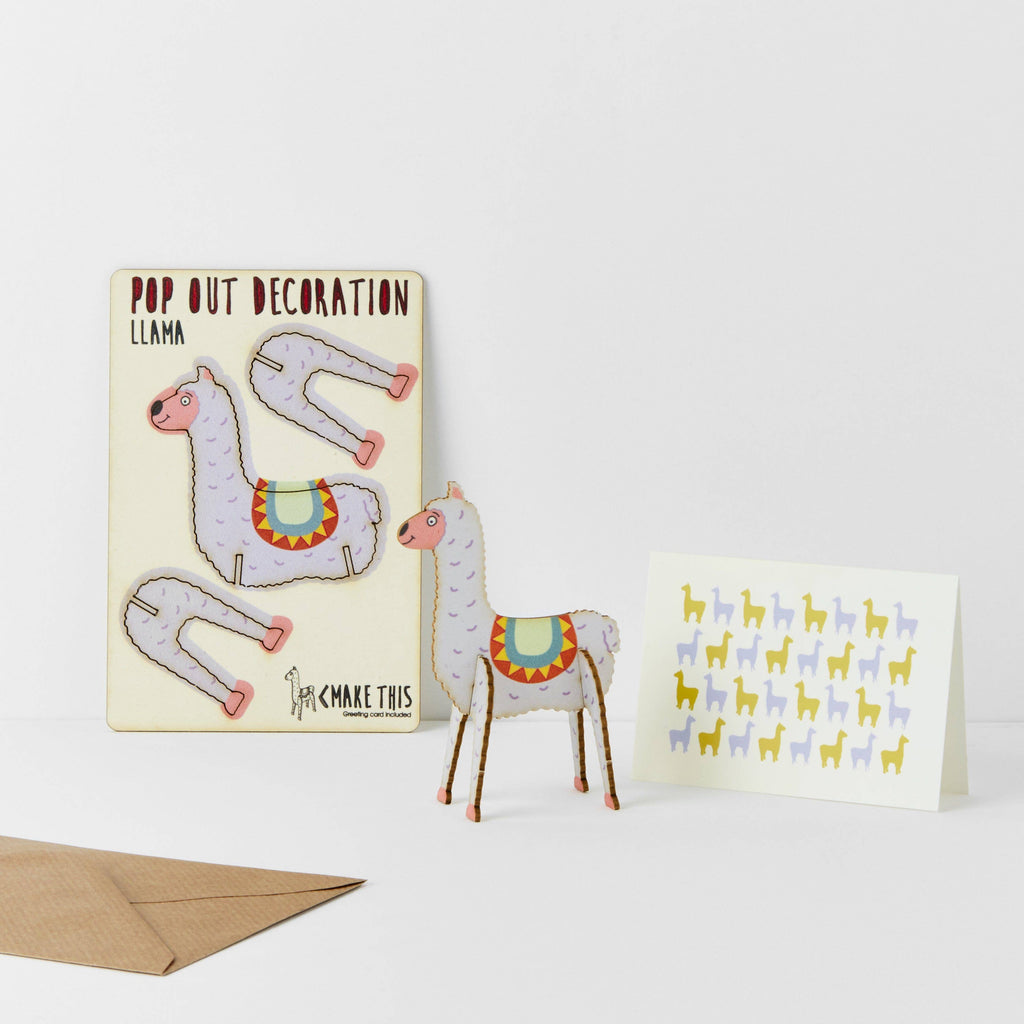 A greeting card featuring a whimsical illustration of a llama, set against a colourful background.