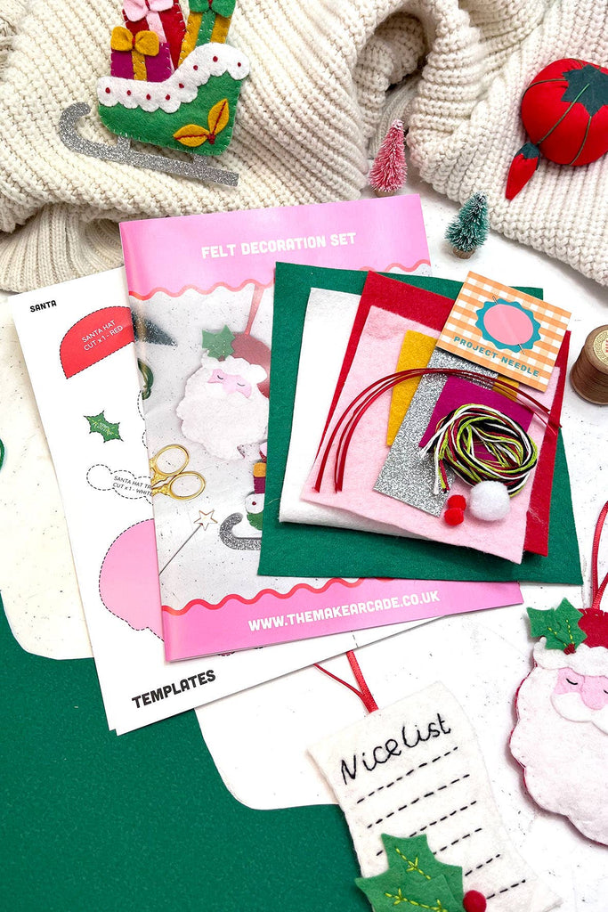 A festive craft kit containing felt Santa and assorted decorations, perfect for holiday crafting activities.