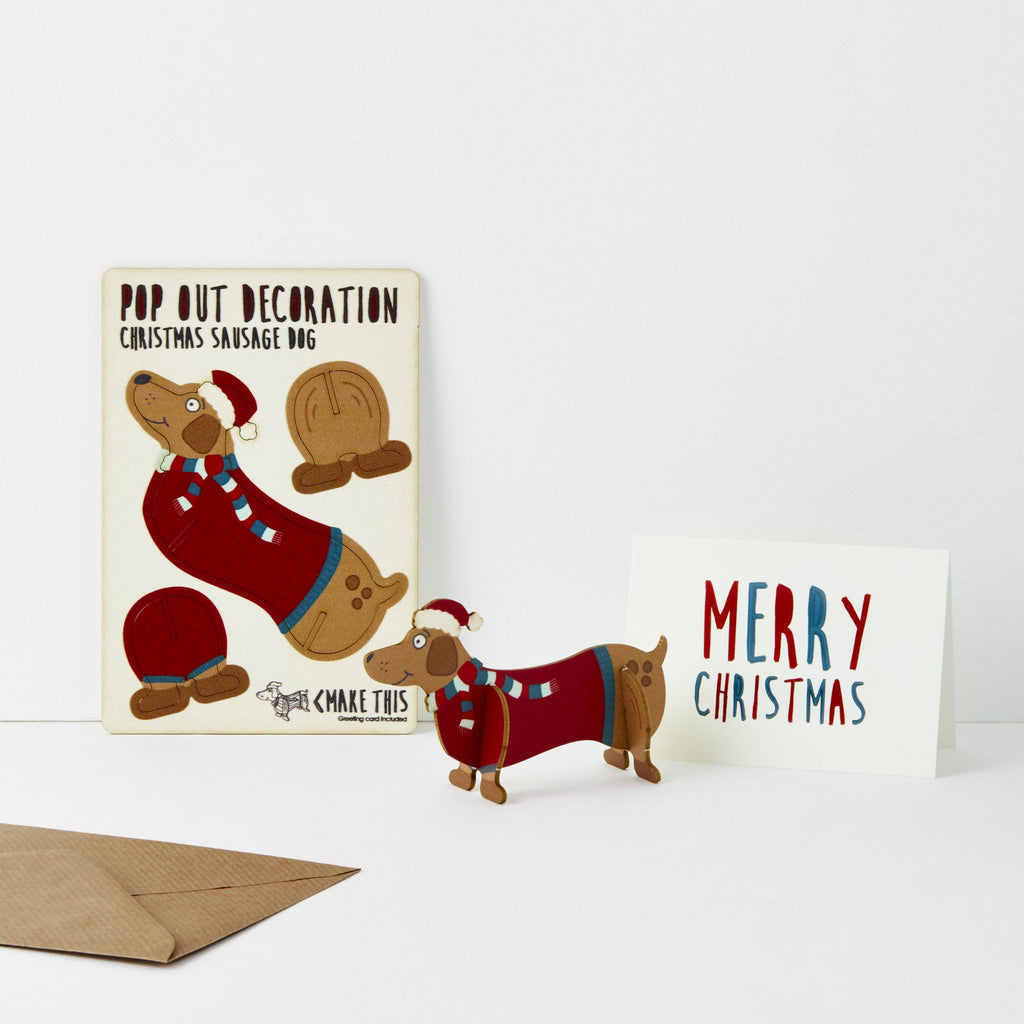 Sausage dog Christmas pop out card wearing a santa hat and stripe scarf