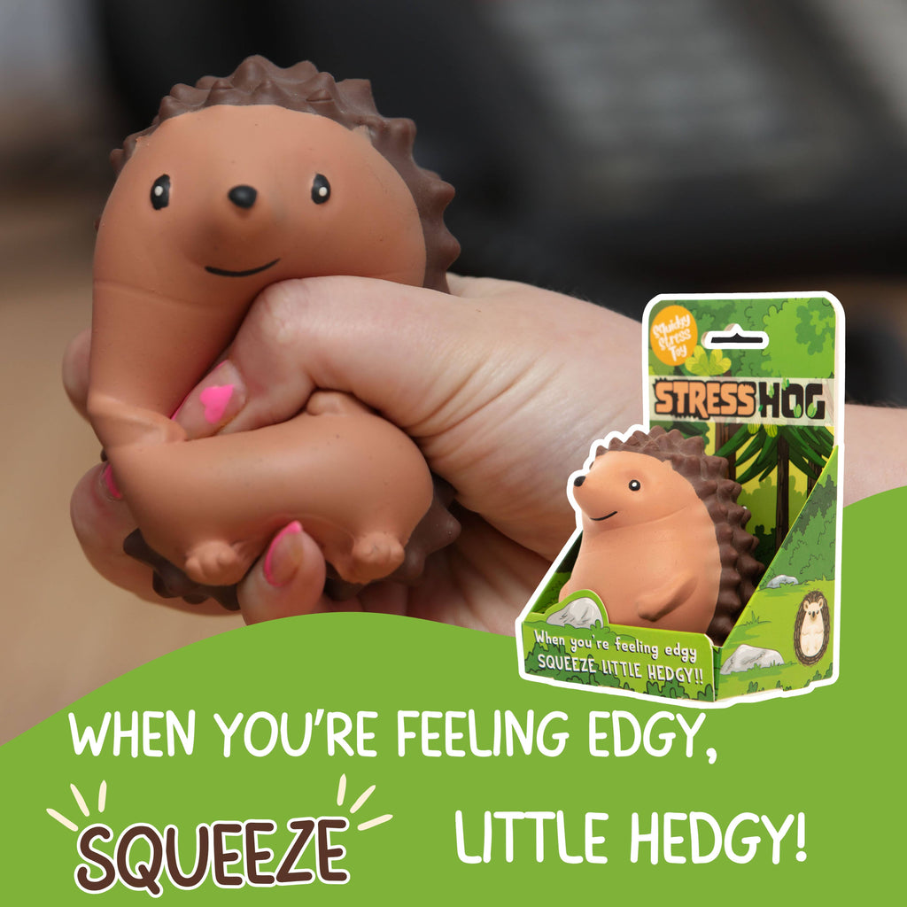 A hand grasps a hedgehog toy, emphasizing its charming appearance and cuddly material.