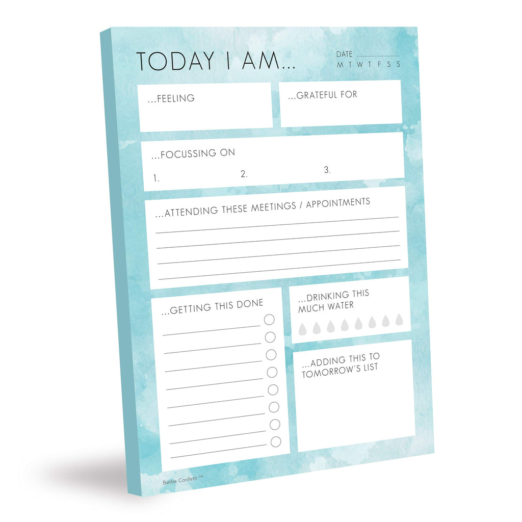 A bright blue planner lying flat, featuring splashes of colour, inviting artistic expression and creativity today in noting your daily tasks and affirmations.