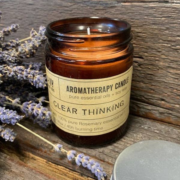 A clear thinking candle, glowing softly, embodies clarity and concentration, enhancing a calm and focused atmosphere.