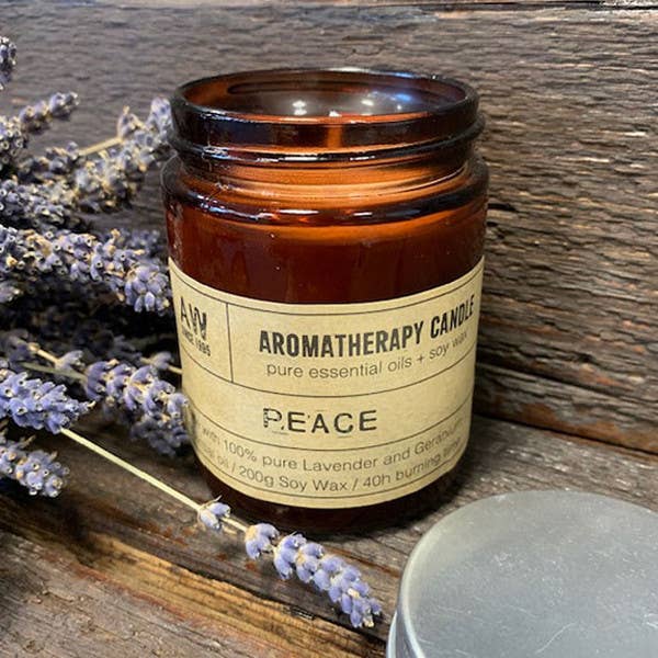 Lavender and geranium essential oil candle in a stylish jar, offering 40 hours of soothing aroma, perfect for any occasion.