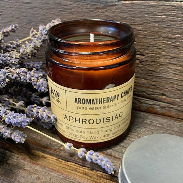 Luxurious aromatherapy candles in amber jars, infused with essential oils for a calming atmosphere and a perfect gift option.