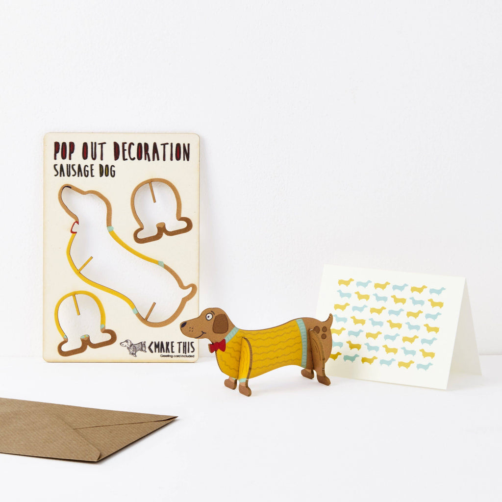 Sausage dog pop out wooden greeting card wearing yellow knitted jumper and red bowtie