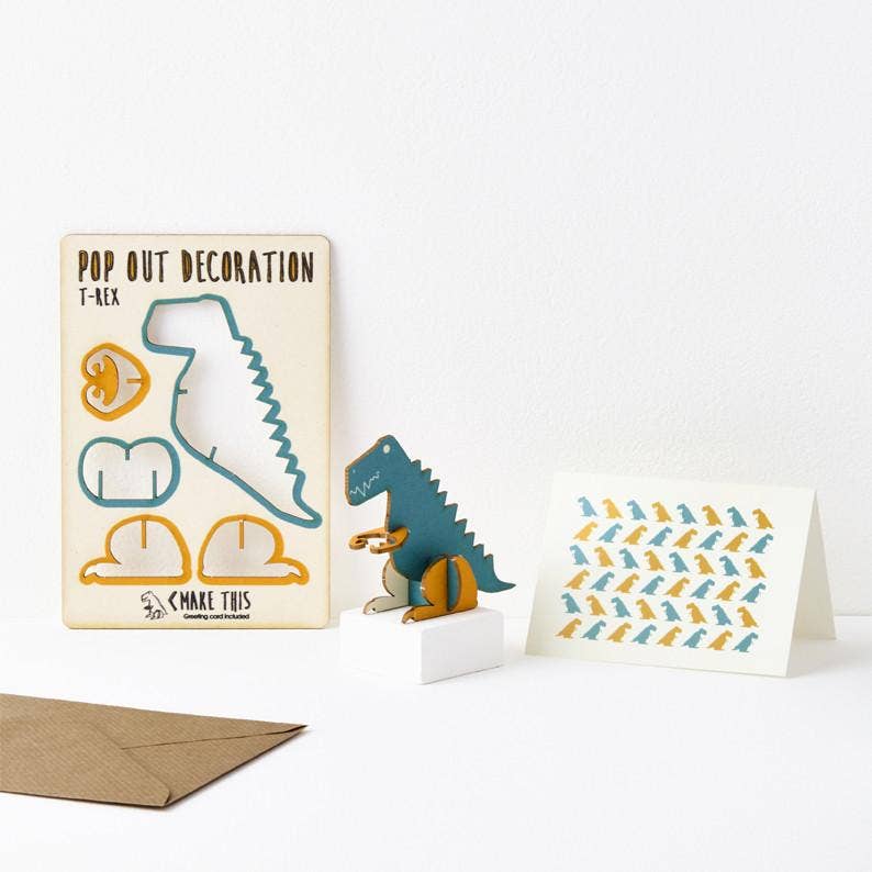 T Rex blue and yellow dinosaur pop out wooden card standing on a little white podium